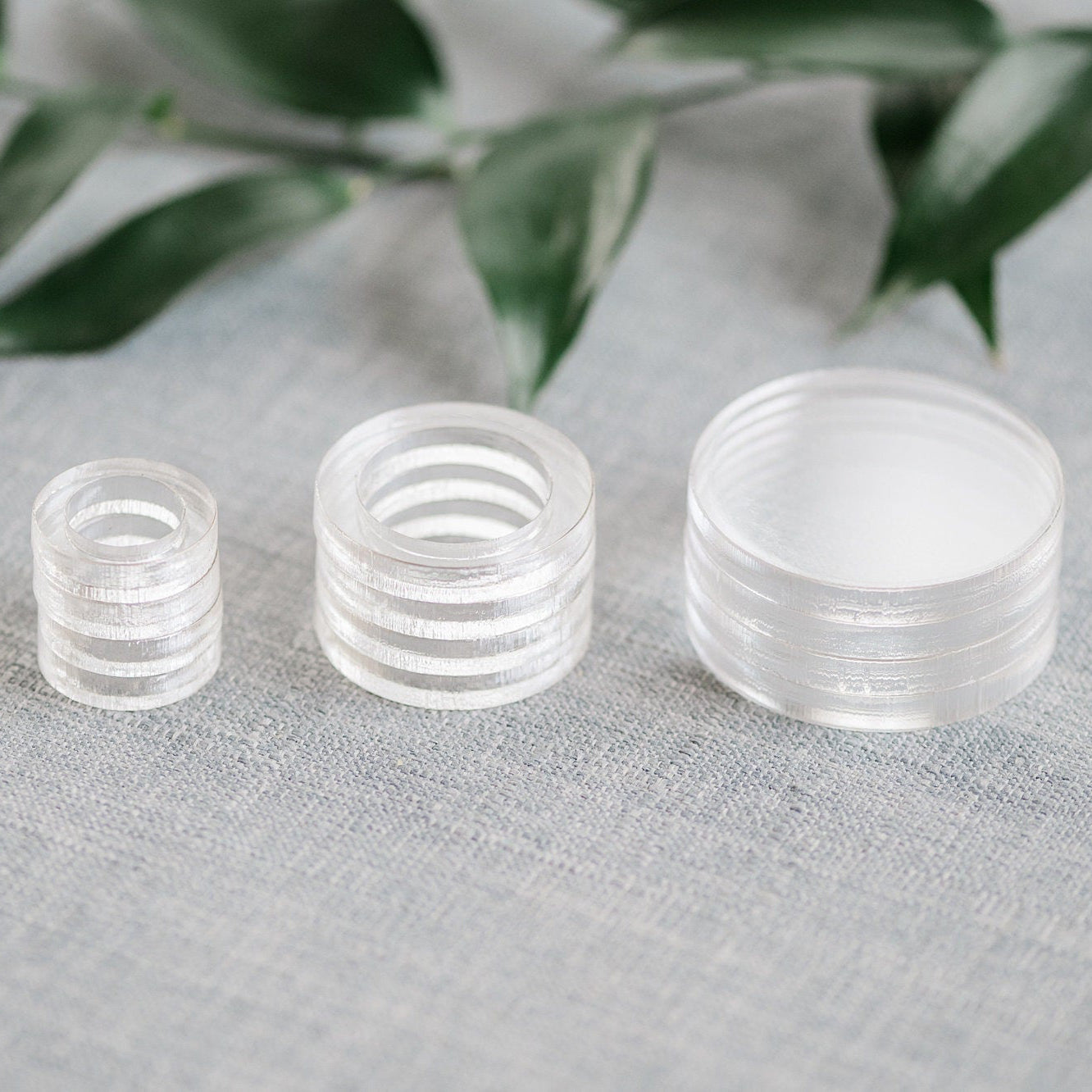 stack of clear acrylic flat lay floral styling risers
