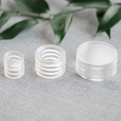 stack of clear acrylic flat lay floral styling risers